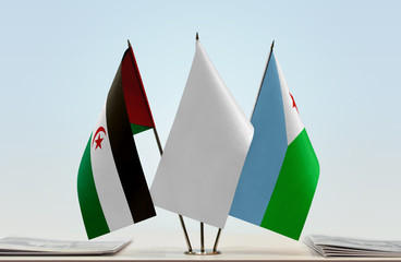 Flags of Sahrawi Arab Democratic Republic and Djibouti with a white flag in the middle