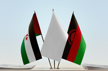 Flags of Sahrawi Arab Democratic Republic and Malawi with a white flag in the middle