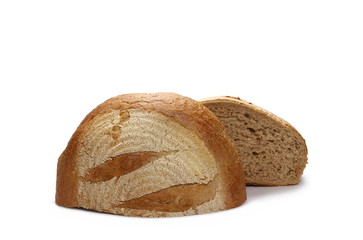 Loaf of wheat bread sliced in half isolated on white background