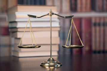 Law and Justice concept. Law books on background