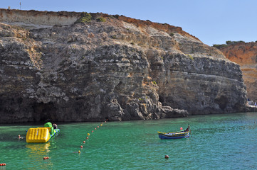 Bay of the island of Gozo with rocks and turquoise sea