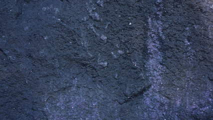 Dark surface of a stone for a background.