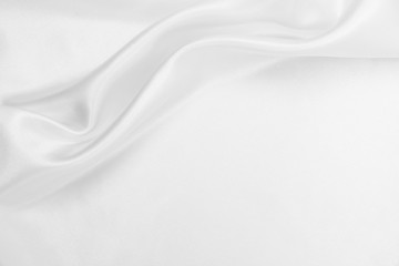 Naklejka premium Smooth elegant white silk or satin luxury cloth texture as wedding background. Luxurious background design