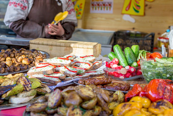 Sandwiches, vegetables, mushrooms and other food at the street food festival