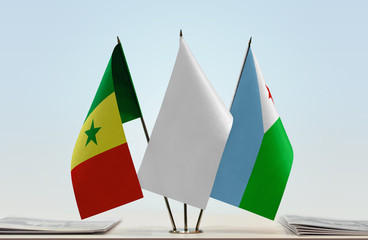 Flags of Senegal and Djibouti with a white flag in the middle