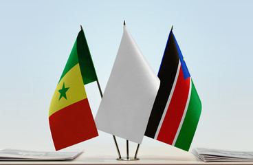 Flags of Senegal and South Sudan with a white flag in the middle