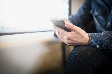 Close up of a woman using mobile smart phone.