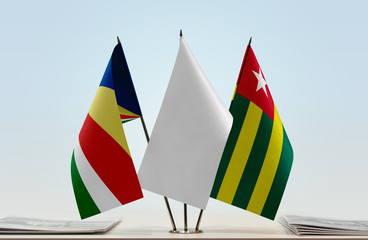 Flags of Seychelles and Togo with a white flag in the middle