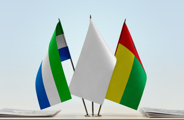 Flags of Sierra Leone and Guinea-Bissau with a white flag in the middle