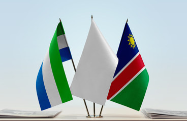 Flags of Sierra Leone and Namibia with a white flag in the middle