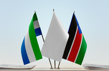 Flags of Sierra Leone and South Sudan with a white flag in the middle