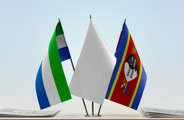 Flags of Sierra Leone and Swaziland with a white flag in the middle