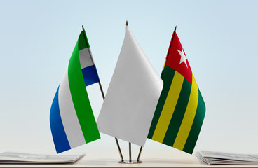 Flags of Sierra Leone and Togo with a white flag in the middle