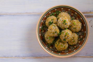 Beef meatballs with rice, onion and carrot in broth. View from above, top, horizontal