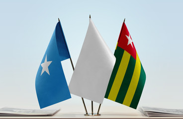 Flags of Somalia and Togo with a white flag in the middle