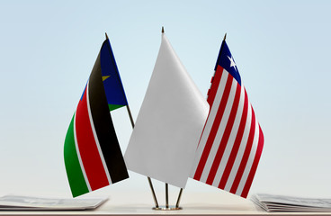Flags of South Sudan and Liberia with a white flag in the middle