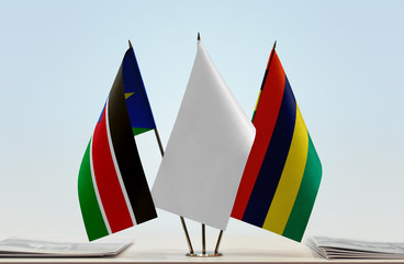 Flags of South Sudan and Mauritius with a white flag in the middle