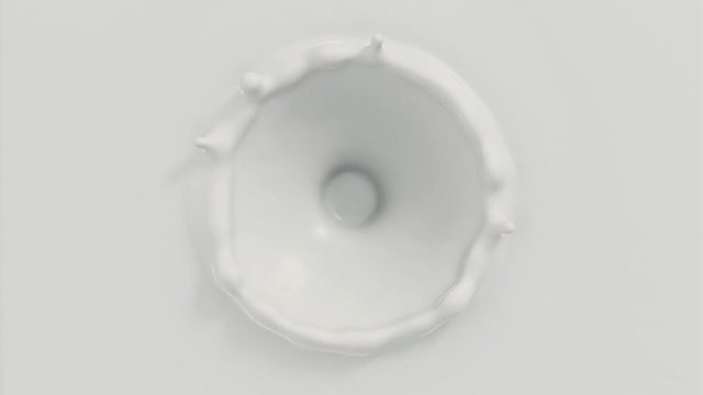 4k Slow-motion milk dropping and splashing forming a beautiful crown splash (top view)