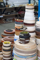 Furniture accessories. Multicolored bobbins of PVC edge and melanin for the manufacture of furniture.