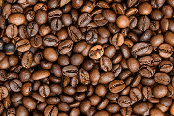Roasted coffee beans, can be used as a background. Coffee beans texture macro