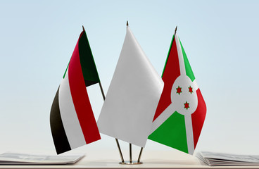 Flags of Sudan and Burundi with a white flag in the middle
