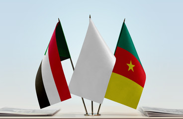 Flags of Sudan and Cameroon with a white flag in the middle