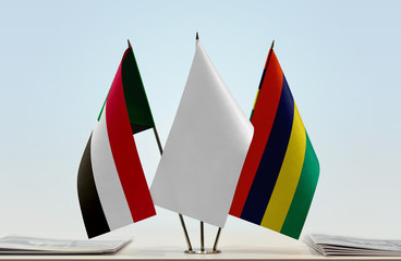 Flags of Sudan and Mauritius with a white flag in the middle