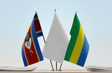 Flags of Swaziland and Gabon with a white flag in the middle
