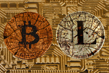Broken coins bitcoin and litecoin on the gold circuit background. Broken bitcoin. Old litecoin.