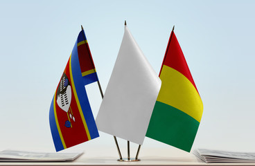 Flags of Swaziland and Guinea with a white flag in the middle
