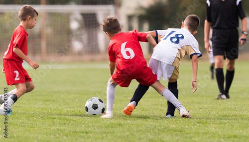 Young Children Players Football Match On Soccer Field Stock Photo
