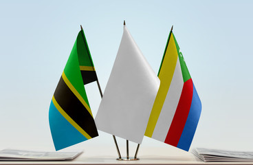 Flags of Tanzania and Comoros with a white flag in the middle