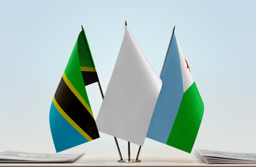 Flags of Tanzania and Djibouti with a white flag in the middle