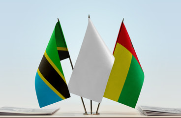 Flags of Tanzania and Guinea-Bissau with a white flag in the middle