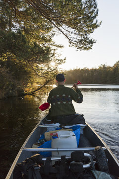 Rear view of man kayaking in Blekinge, Sweden