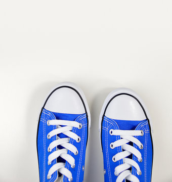 blue sneakers in white background
