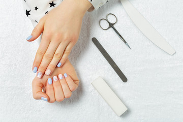 Woman hands receiving a manicure in beauty salon
