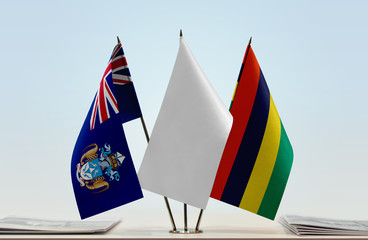 Flags of Tristan da Cunha and Mauritius with a white flag in the middle