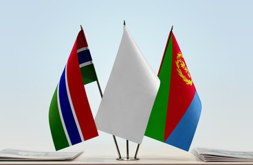 Flags of The Gambia and Eritrea with a white flag in the middle