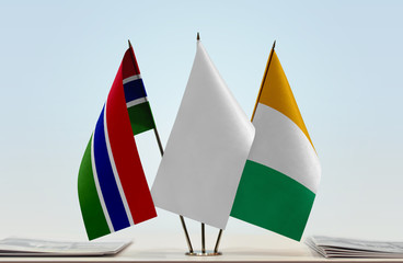 Flags of The Gambia and Ivory Coast with a white flag in the middle