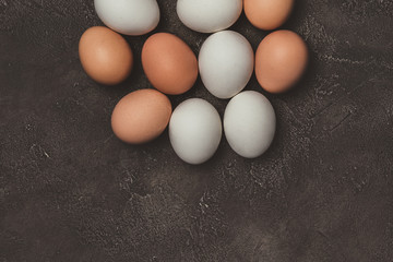 top view of white and brown chicken eggs on table