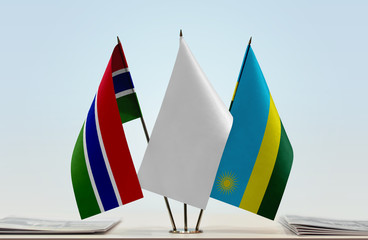 Flags of The Gambia and Rwanda with a white flag in the middle
