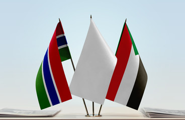 Flags of The Gambia and Sudan with a white flag in the middle