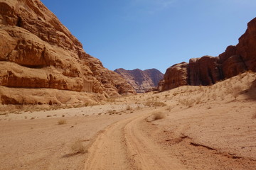 Fototapeta na wymiar Jordanian desert in Wadi Rum, Jordan. Wadi Rum has led to its designation as a UNESCO World Heritage Site. It is known as The Valley of the Moon in Middle East