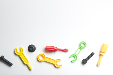 Kids educational developing toys frame on white background. Top view. Flat lay. Copy space for text