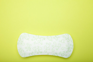 Close up, sanitary hygiene protection on green background. Empty copy space for text.