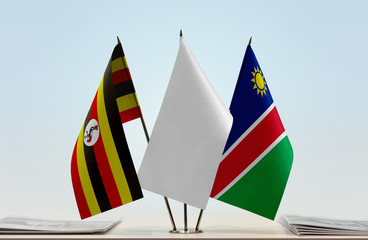 Flags of Uganda and Namibia with a white flag in the middle