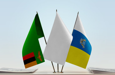 Flags of Zambia and Canary Islands with a white flag in the middle