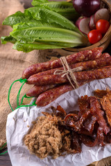 Chinese sausage and Pounded pork jerky for cook on a wooden background
