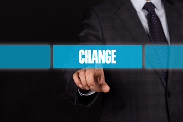 Hand pushing on a touch screen interface-CHANGE button